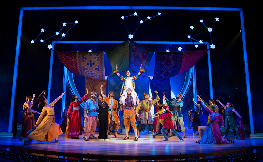 Full stage shot of the cast of Joseph