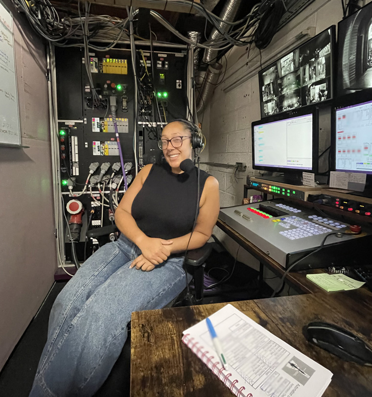 Adannae sat in the control room at the theatre
